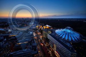 Aerial city view at dusk with circular target overlay symbolizing strategic real estate planning and precision market selection